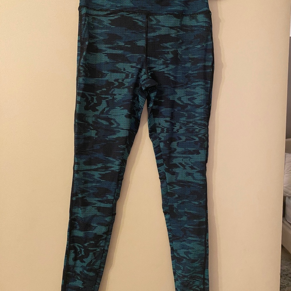 Black/teal pixel looking patterned workout pants